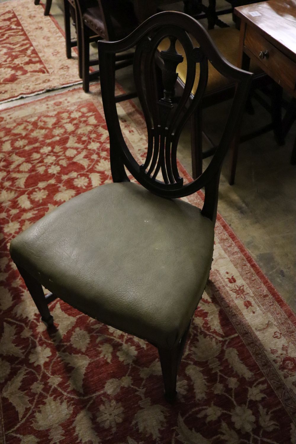 A pair of Victorian Hepplewhite style chairs with leather seats